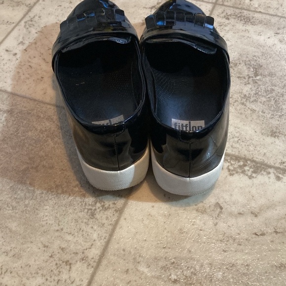 Fit flip black shiny frilly loafers style black shed with small mark on one toe. - Picture 4 of 10